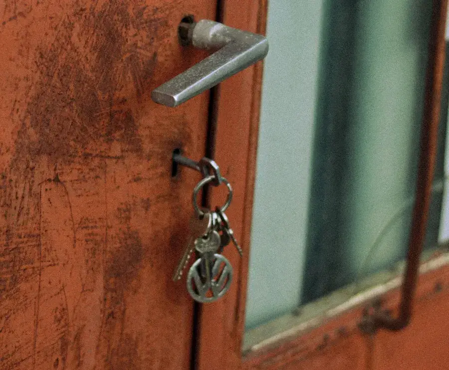 Keys hanging from the lock of an old door – why keys snap and when broken key removal Castleford is needed, Locksmith Castleford