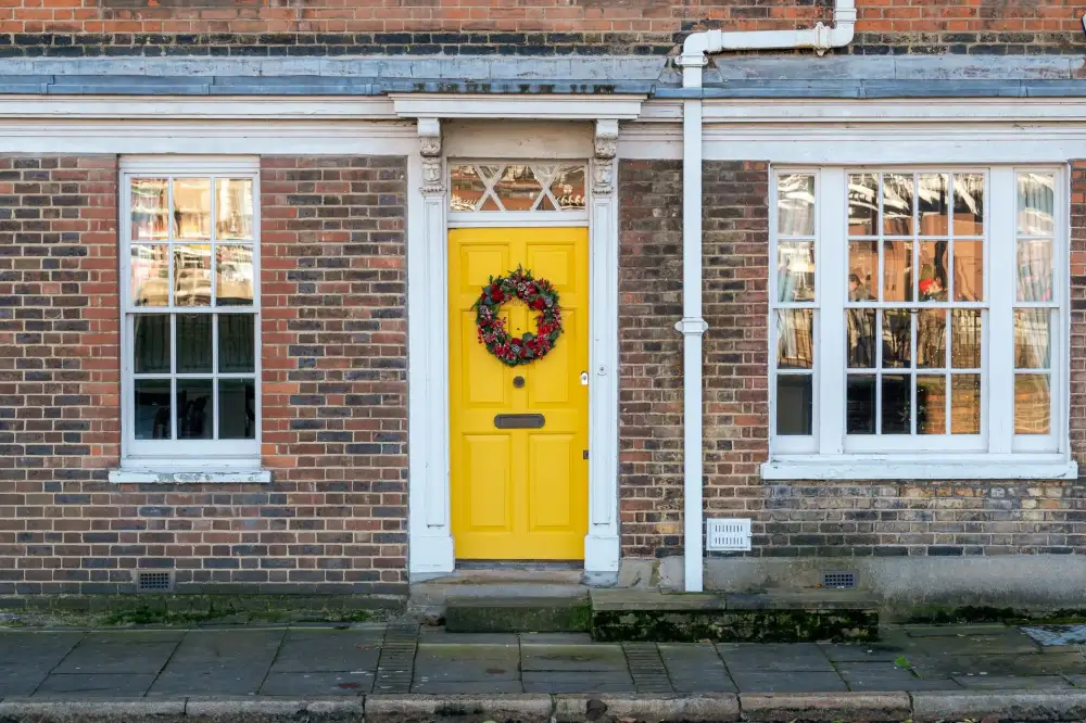 Yellow front door on a red-brick Victorian house – residential locksmith Castleford front door security check by Locksmith Castleford