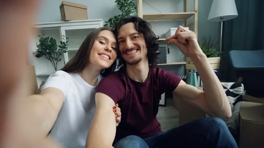 Couple holding up keys in their new home – residential locksmith Castleford help for homeowners from Locksmith Castleford